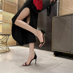 Elegant Stiletto Heels with Pearl Ankle Strap – These stunning heels combine a sleek, pointed-toe design with a delicate pearl-embellished ankle strap