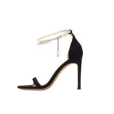 Elegant Stiletto Heels with Pearl Ankle Strap – These stunning heels combine a sleek, pointed-toe design with a delicate pearl-embellished ankle strap