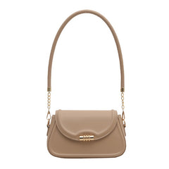 The Sleek Baguette Bag – With its refined, compact silhouette and smooth finish
