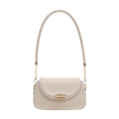 The Sleek Baguette Bag – With its refined, compact silhouette and smooth finish