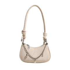 Chic Sling Bag with Chain Accents – This stylish sling bag features a sleek design adorned with elegant chain accents